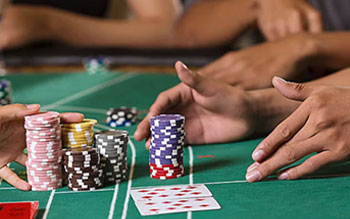 Baccarat table game with banker and player bets in a BC casino