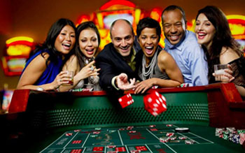 Craps table with dice and players in a land-based casino in BC